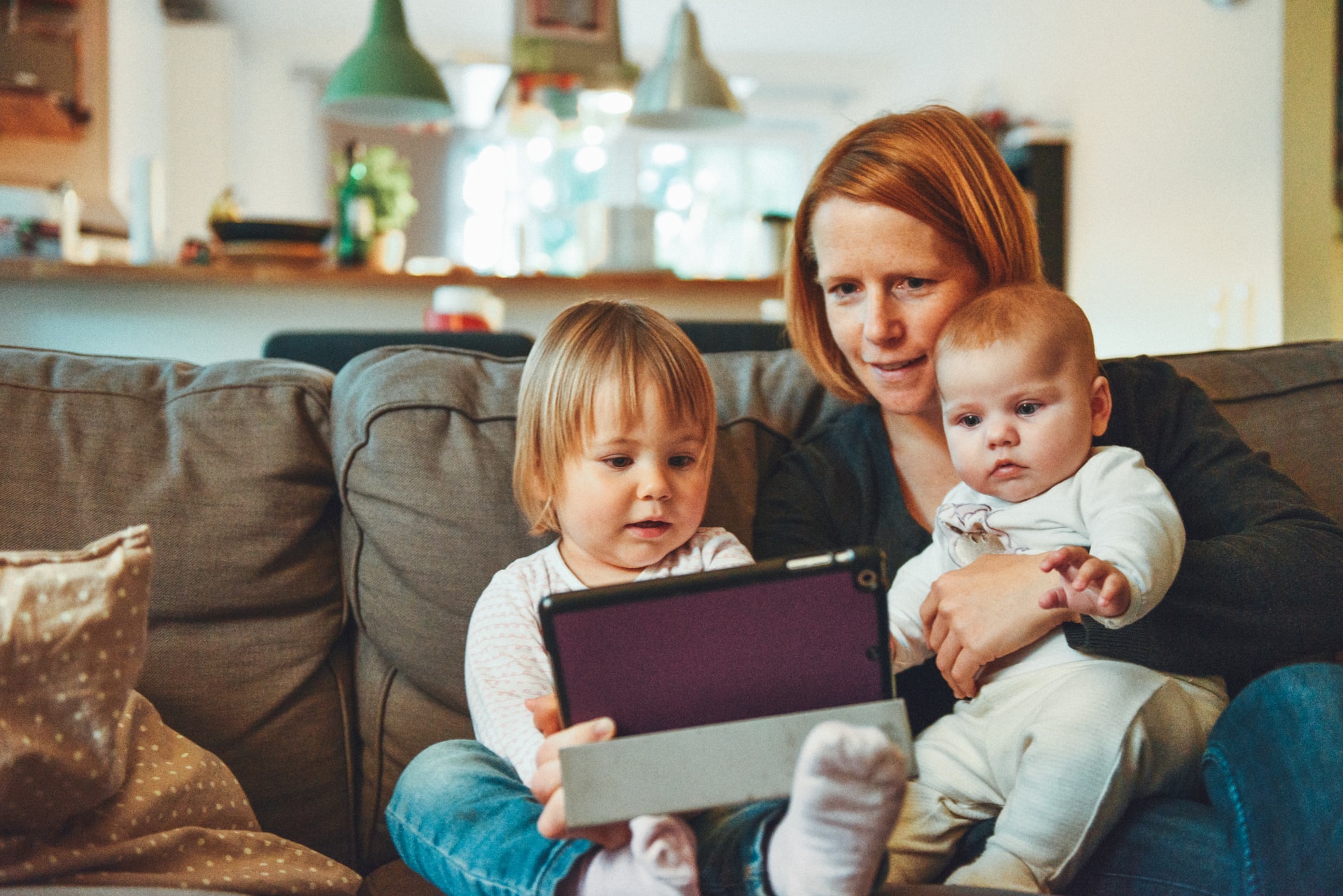 Mothere with two young children on lap